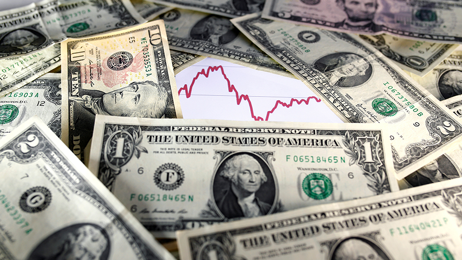 U.S. dollar notes are seen in front of a stock graph in this November 7, 2016 picture illustration. Picture taken November 7.