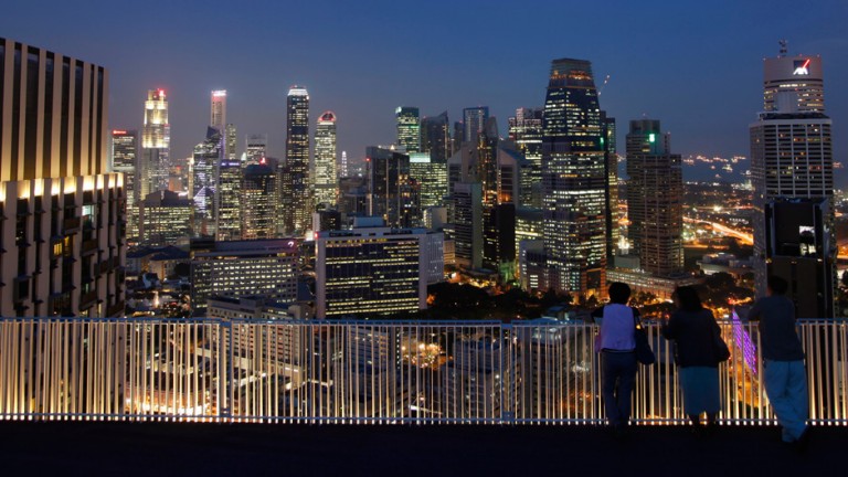 People view the skyline of the central business district in Singapore